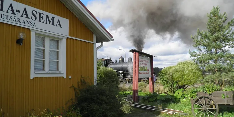 Ilola building with a steam locomotive in the background.