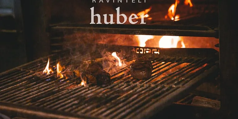Grilling meat at Ravinteli Huber