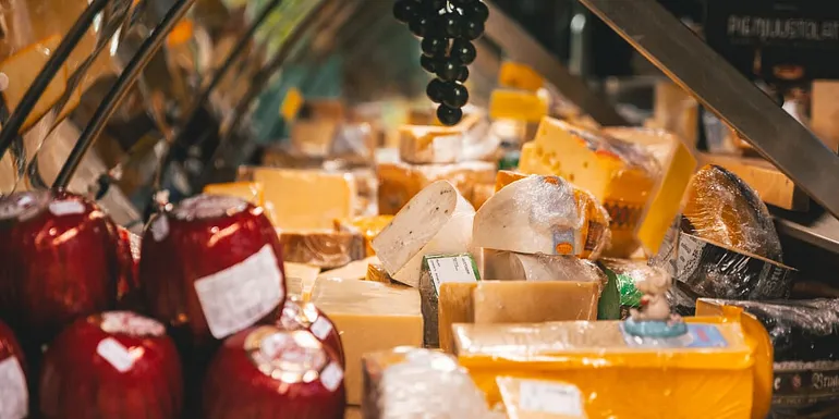 Cheese counter displaying wide variety of cheese types