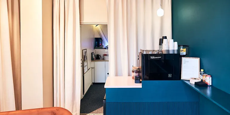 Espresso bar interior, coffee machine and back wall of the coffee shop