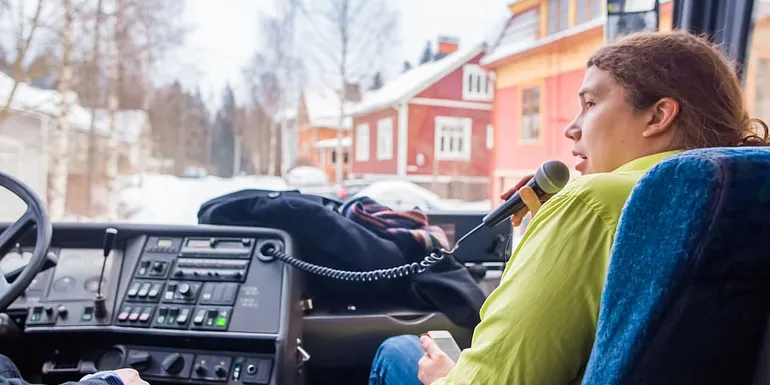 Tour guide in the bus.