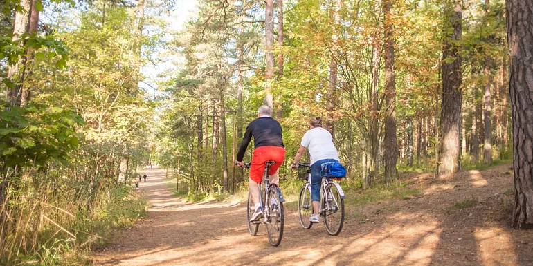 People biking on the nature trail.