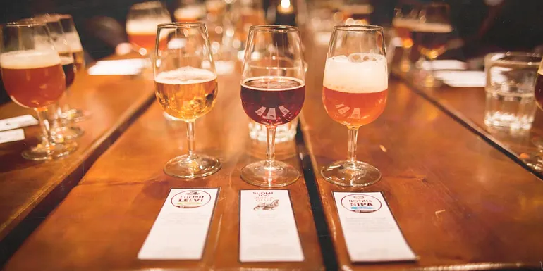 Three craft beers on a table.