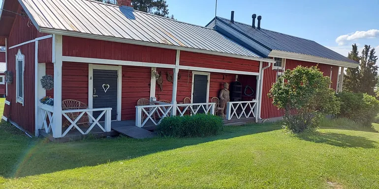 Wooden old single-story barn from the 19th century, lattice fences