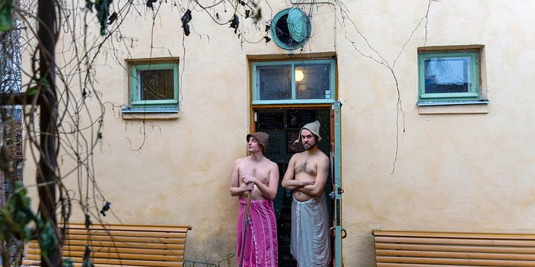 Matti and Juha standing in front of Rajaportti public sauna