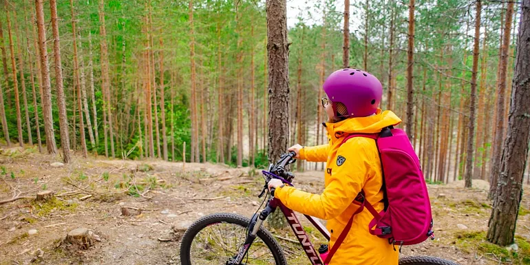 The cyclist in a ridge landscape