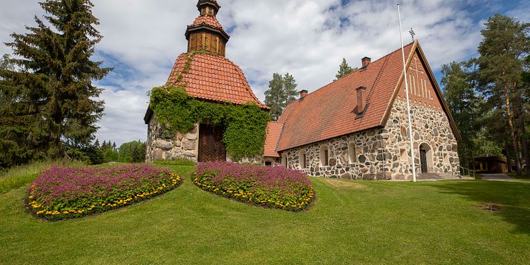 Medieval style church with red tiled roofing.