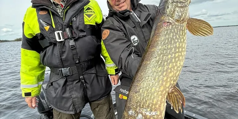 The guide and customer with a big pike