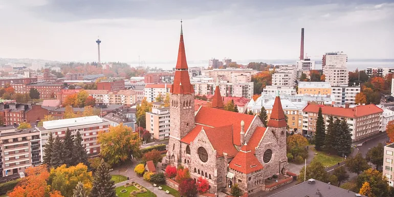 Aerial view of the Tampere Cathedral towering over the city