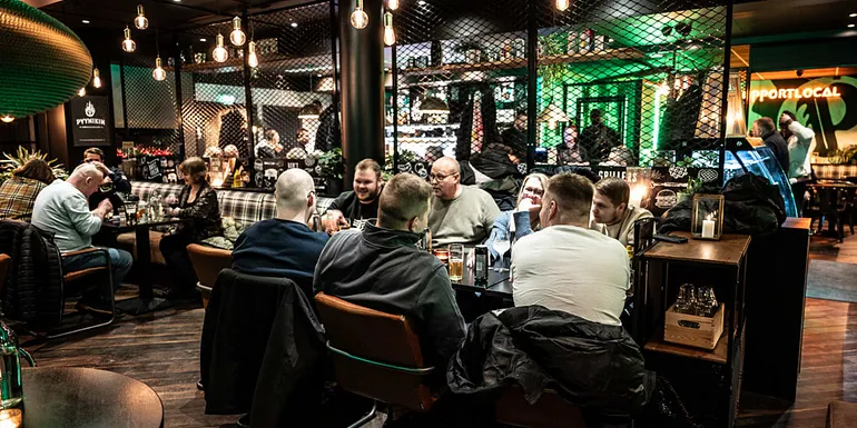 Restaurant hall, people sitting at the restaurant table